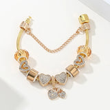 Golden Embrace: The Vintage Heart Charm Bracelet