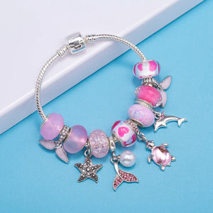 Lunar Petals: The Pink Butterfly Charm Bracelet