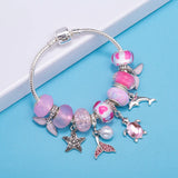 Lunar Petals: The Pink Butterfly Charm Bracelet