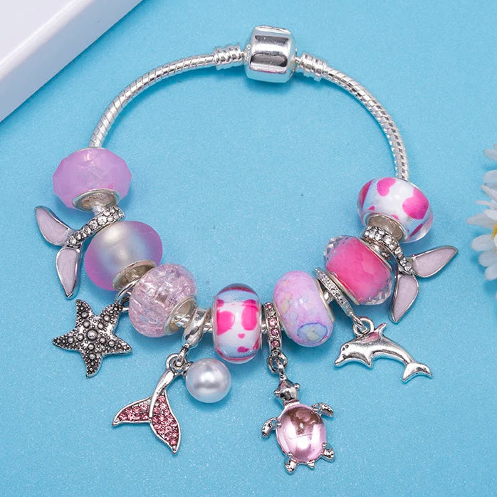 Lunar Petals: The Pink Butterfly Charm Bracelet